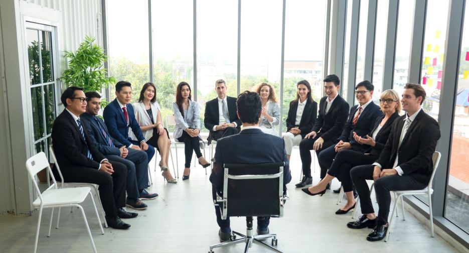Shot of a group of businesspeople having a discussion in an office